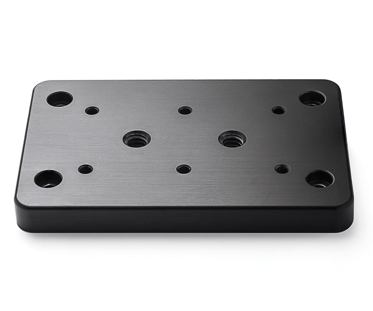 Bolex cheese plate showcased on white background. Designed for rear attachment on Bolex cameras.