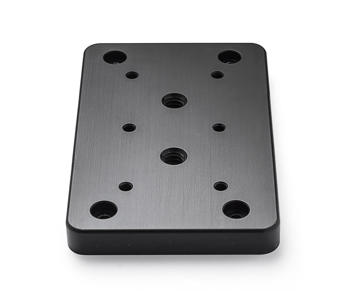 Bolex cheese plate showcased on white background. Designed for rear attachment on Bolex cameras.