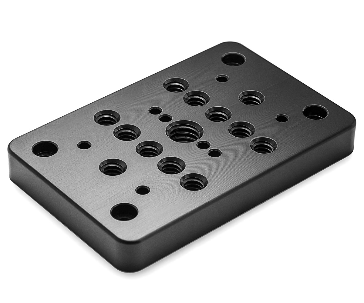 Bolex cheese plate showcased on white background. Designed for rear attachment on Bolex cameras.