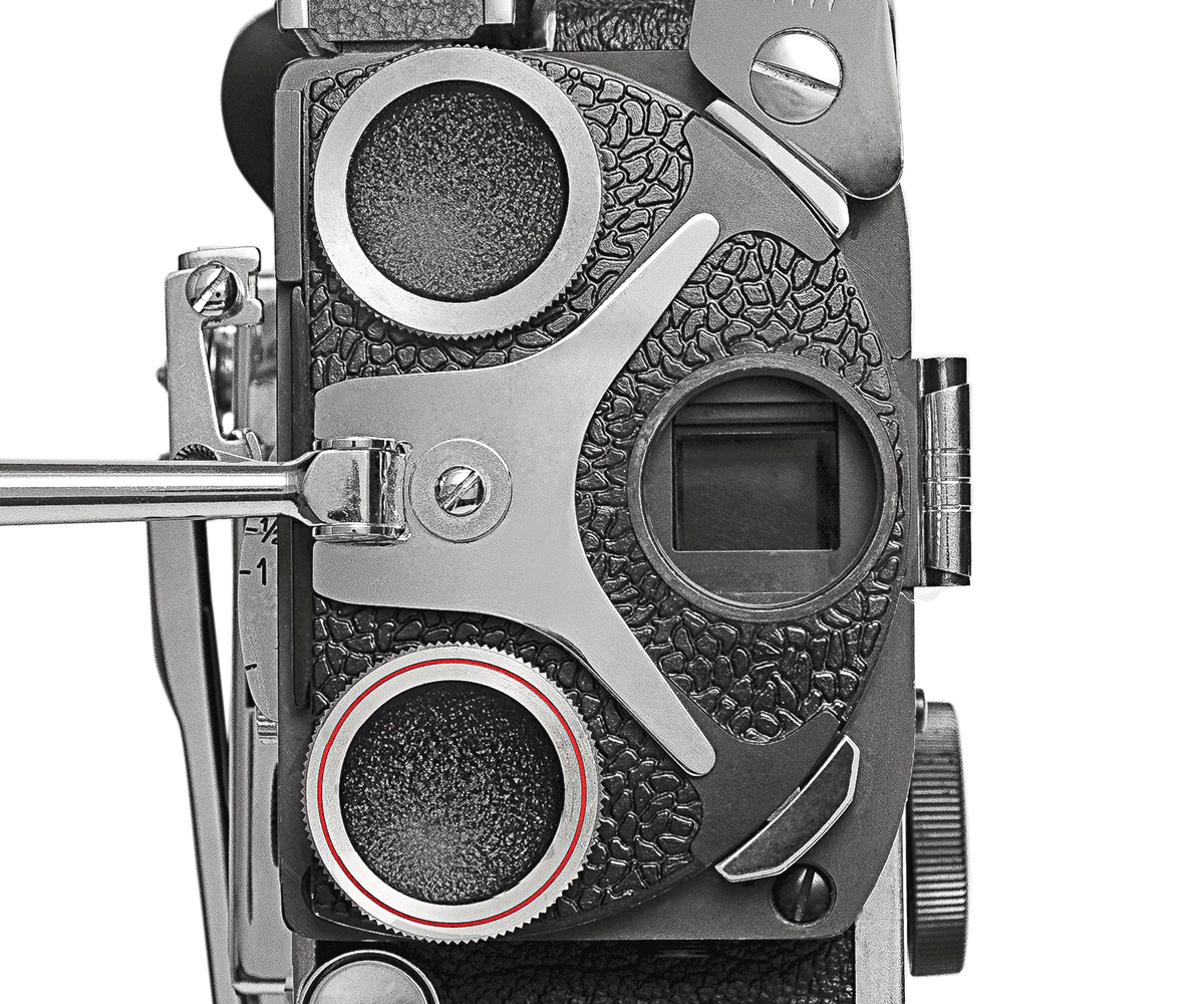 Bolex turret showcased on white background without cap showing the Bolex prism. 