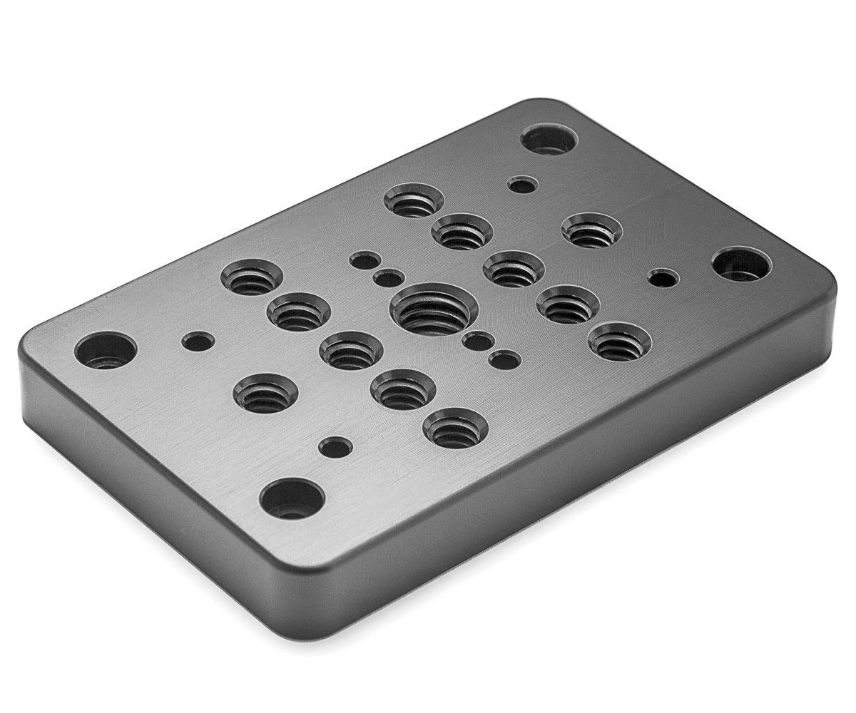 Bolex grey cheese plate showcased on white background. Designed for rear attachment on Bolex cameras.