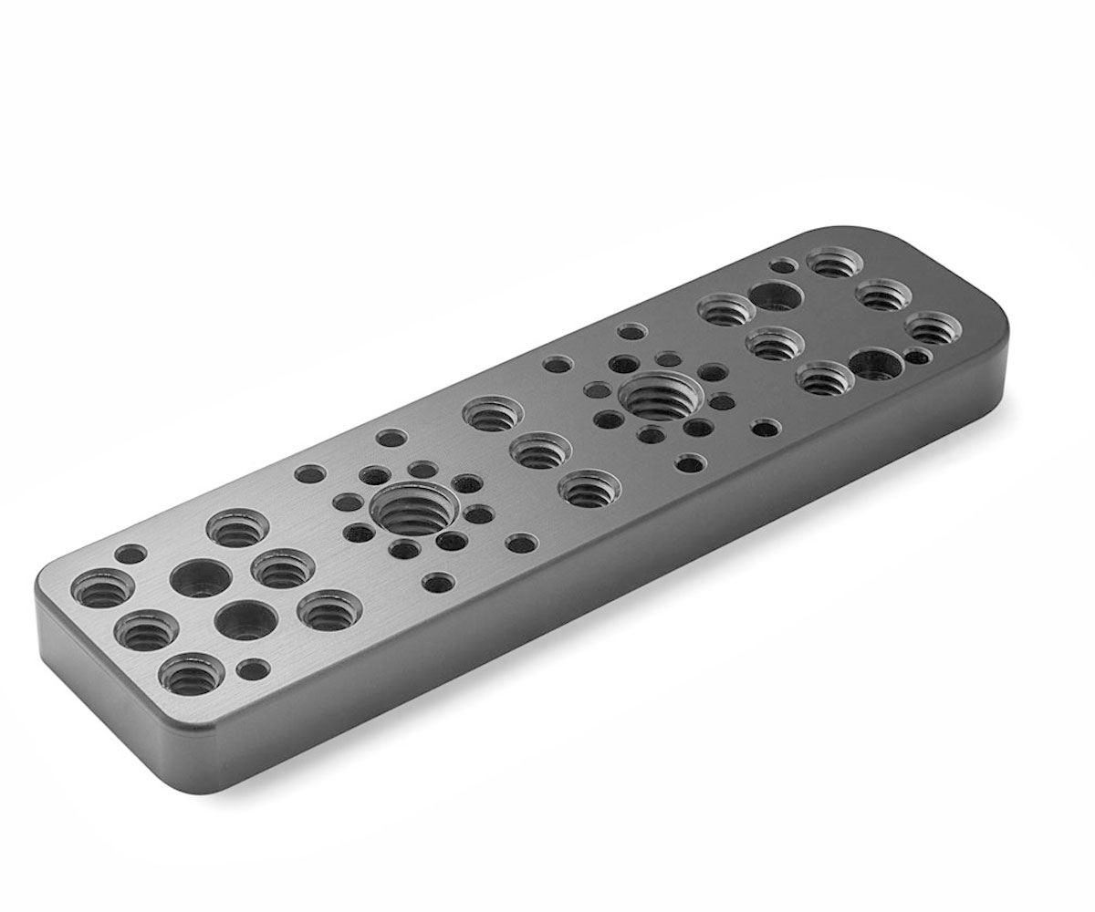 Bolex grey right side plate showcased on white background. Designed for door attachment on Bolex cameras.