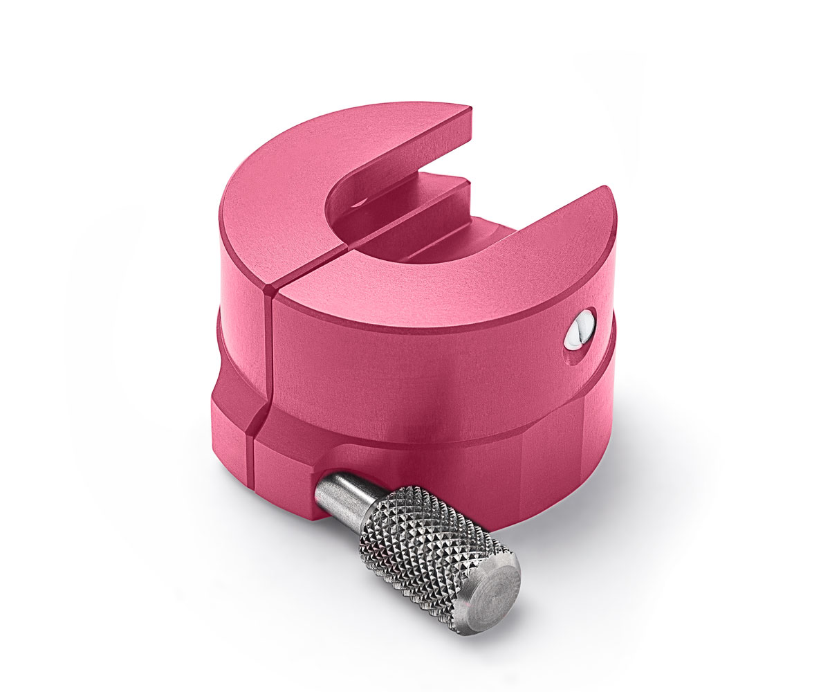 A studio photograph of the pink Bolex 10X red viewfinder adapter.