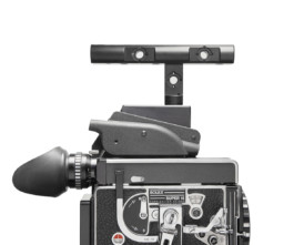 Bolex rex5 camera on white background with top plate and top handle. 